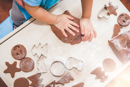 Baking gingerbreads. The family is preparing a gingerbread.arranged gingerbread and molds.の写真素材