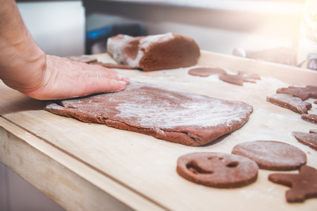 Baking gingerbreads. The family is preparing gingerbreads.の写真素材