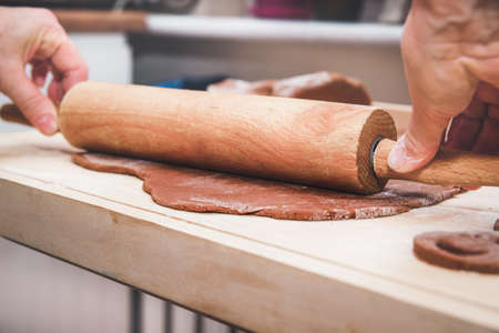 Christmas preparations. Cooking and baking concept. Kneading gingerbread, baking gingerbreads.の写真素材