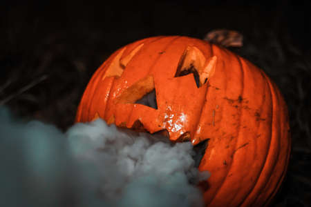 Pumpkin smoking from the mouthの写真素材