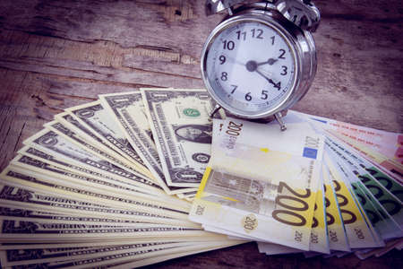 Business concept with money Euro and American Dollar on wooden board. Black and whiteの写真素材