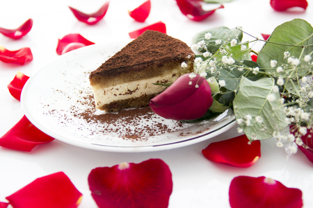 Cake with cocoa among red rose petals. Happy Valentines dayの写真素材