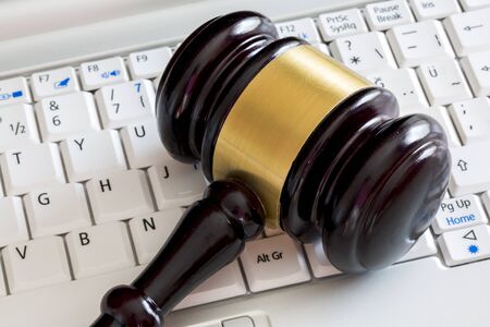 Law concept. Close up of judge gavel and laptop