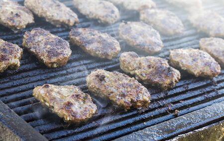 Meatballs on smoking grill. Barbecue in natureの写真素材