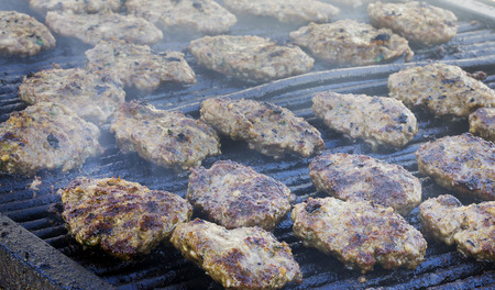 Meatballs on smoking grill. Barbecue in nature