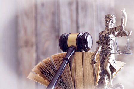 Law concept. Gavel, statue and bookの写真素材