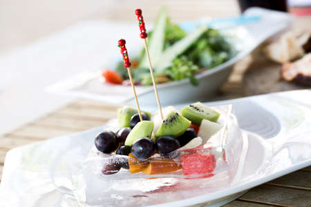 Fruit salad in ice cubeの写真素材