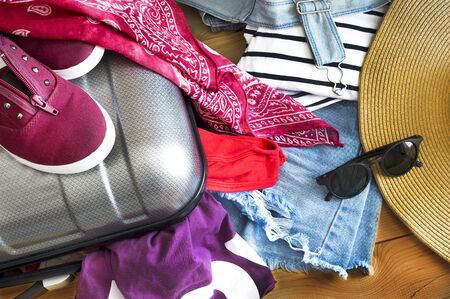 Holiday suitcase and summer accessories. Travel conceptの写真素材