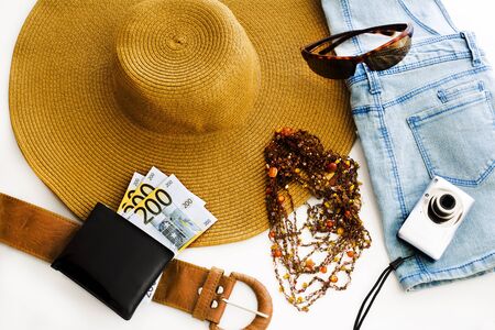 Summer travel vacation concept. Straw hat, money and summer accessories