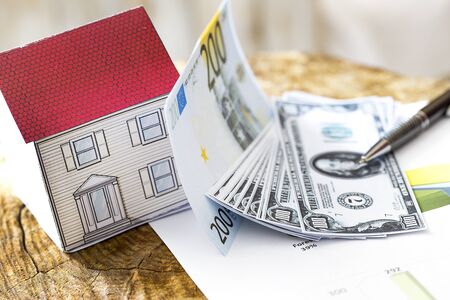 Mortgage, close up of home model, dollar money, investment, real estate and property conceptの写真素材