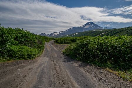 Panoramic view of the city Petropavlovsk-Kamchatsky and volcanoes: Koryaksky Volcano, Avacha Volcano, Kozelsky Volcano. Russian Far East, Kamchatka Peninsula.の写真素材