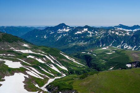 Panoramic view of the city Petropavlovsk-Kamchatsky and volcanoes: Koryaksky Volcano, Avacha Volcano, Kozelsky Volcano. Russian Far East, Kamchatka Peninsula.の写真素材