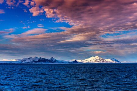 norway landscape ice nature of the glacier mountains of Spitsbergen Longyearbyen Svalbard arctic ocean winter polar day sunset skyの写真素材