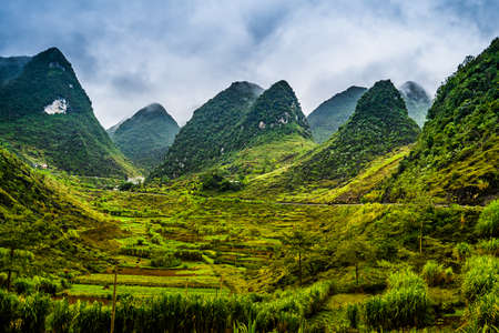 Mountain road in beautiful valley. Ha Giang province. Vietnamの写真素材