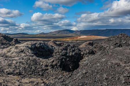 Beautiful colorful Icelandic landscape lava fields mountain geysers zigzag road and moss-covered stones Namafjall, Iceland.の写真素材