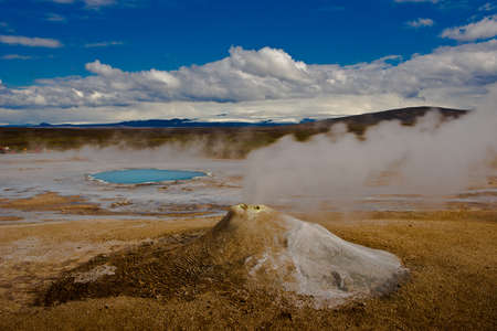 Beautiful colorful Icelandic landscape lava fields mountain geysers zigzag road and moss-covered stones Namafjall, Iceland.の写真素材