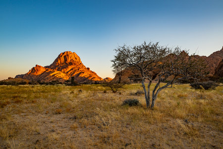 Spitzkoppe, aka Sptizkop - unique rock formation of pink granite in Damaraland landscape, Namibia, Africa.の写真素材