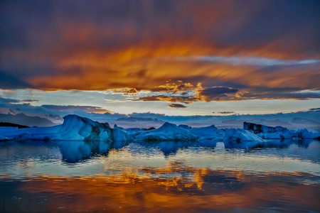 The sun sets over the famous glacier lagoon at Jokulsarlon, Iceland.の写真素材