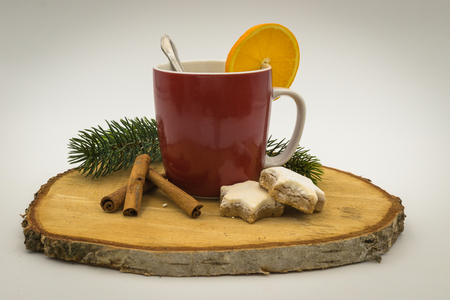 A Cup with christmas decoration on wooden backgroundの写真素材