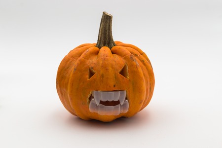 Halloween pumpkin with scary face. Jack O' Lantern isolated on white.