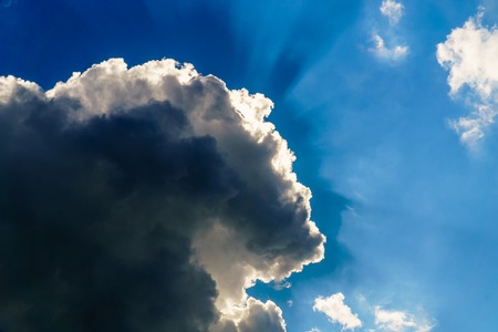 blue sky with sun and beautiful white cloudsの写真素材