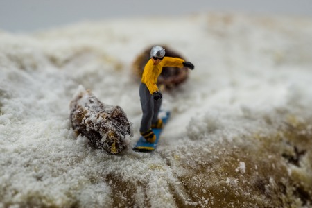 Concept snowboarding on a white mountainの写真素材