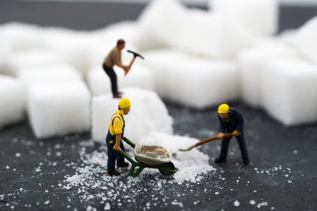 Miniature people Working with sugar. Health care concept.の写真素材