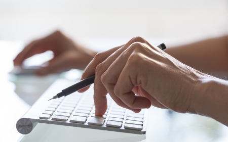 Close-up of woman hands on computer keyboard