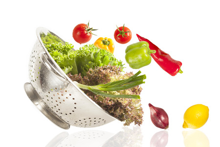 Colorful healthy fresh vegetables in strainerの写真素材