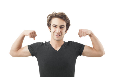 Handsome young man showing his muscles