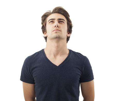 Handsome pensive man looking up on whiteの写真素材