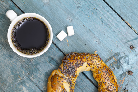 Cup of coffee with bagel top viewの写真素材