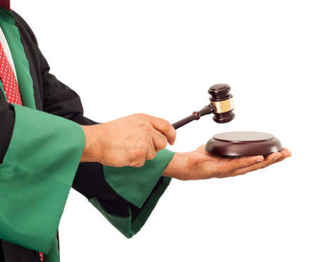 Judge hand knocking gavelの写真素材