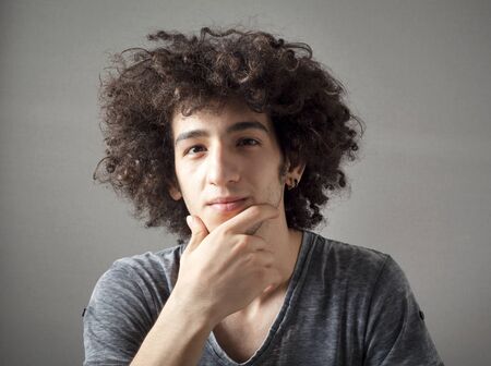 Portrait of thinking young manの写真素材