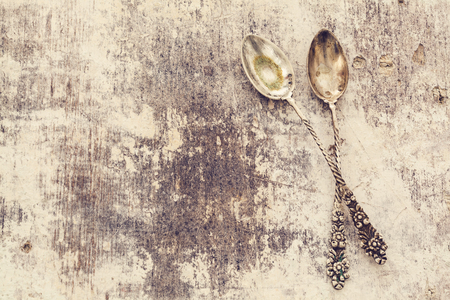 Old spoon on wooden tableの写真素材