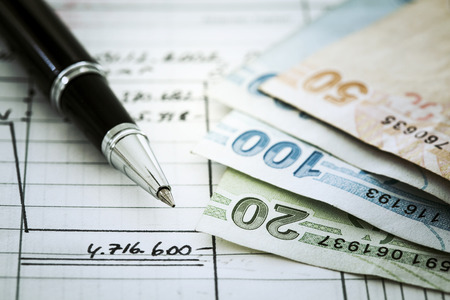 Money and pen on documentの写真素材