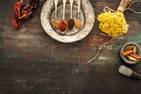 Various spices on vintage boardの写真素材