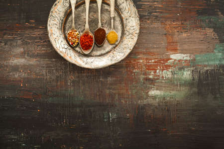 Various spices on vintage boardの写真素材