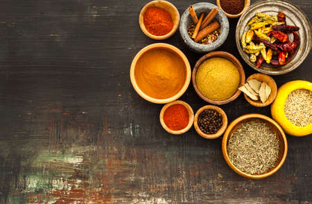 Various spices on vintage board