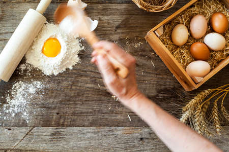 Preparation of the dough on wooden table