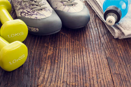 Sport equipments on wooden backgroundの写真素材