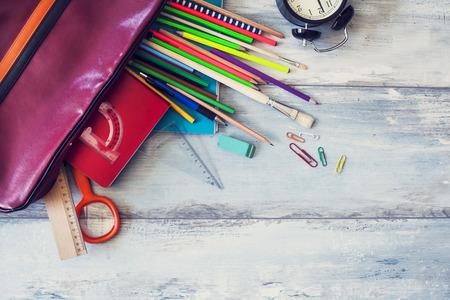 School supplies on wooden background