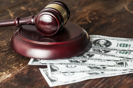 Justice gavel and money on the deskの写真素材