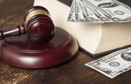 Justice gavel and money on the deskの写真素材