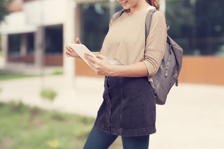 Student girl with tablet in campusの写真素材