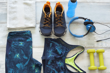 Sports goods on wooden background