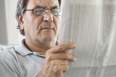 Man senior reading newspaperの写真素材