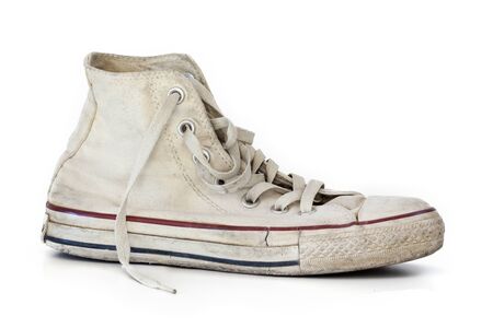 Old white sneakers on white backgroundの写真素材