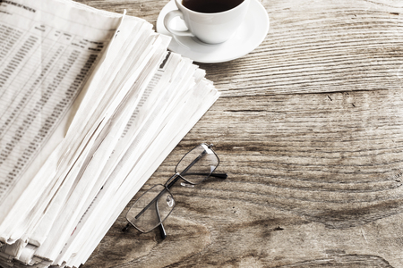 Newspaper on wooden table