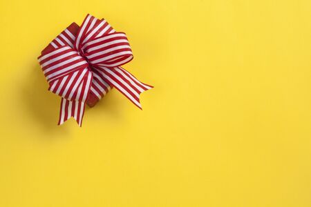 Gift box on yellow background
